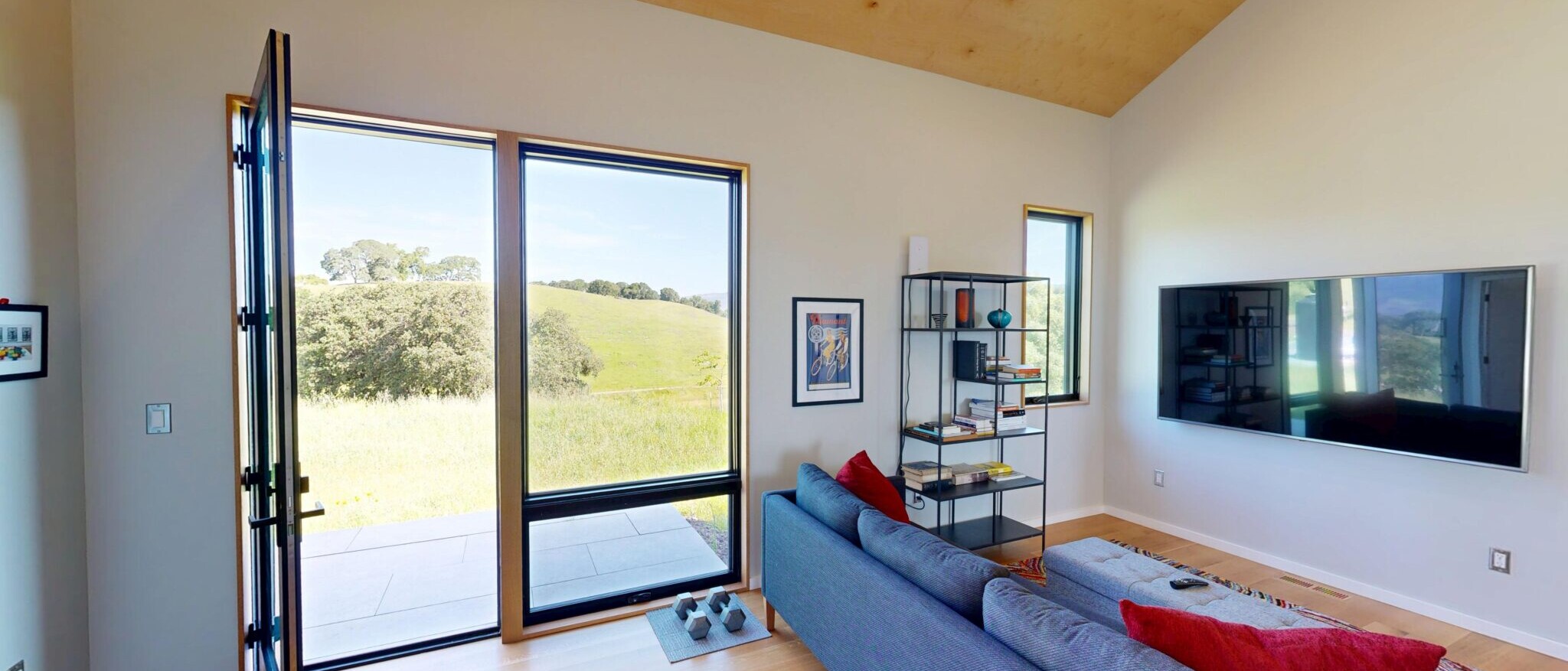 Modern living room interior with large windows and scenic views, part of a custom home built by Black Creek Builders in Napa.
